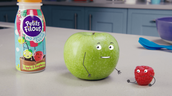 Apple and raspberry characters beside a Petits Filous bottle