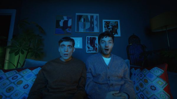 Family gripped by TV drama on a sofa, from the KitKat Channel 4 partnership